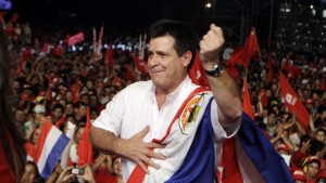 Horacio Cartes, presidential candidate of Colorado Party, dances during a campaign rally in Capiata, Paraguay, Friday, April 5, 2013. Paraguay will hold presidential elections on April 21. (AP Photo/Jorge Saenz)
